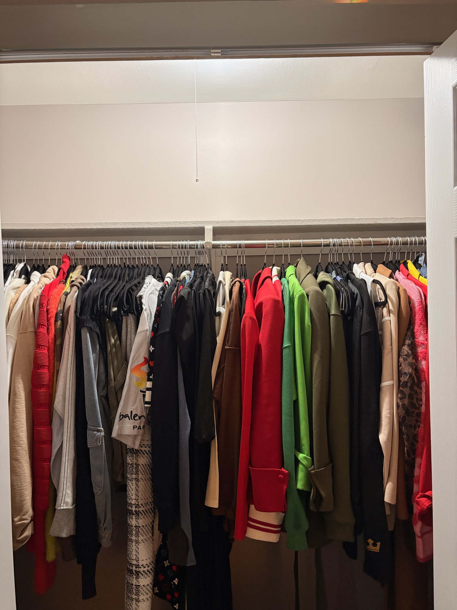 The same bedroom closet sorted, resale pieces pulled into rotation