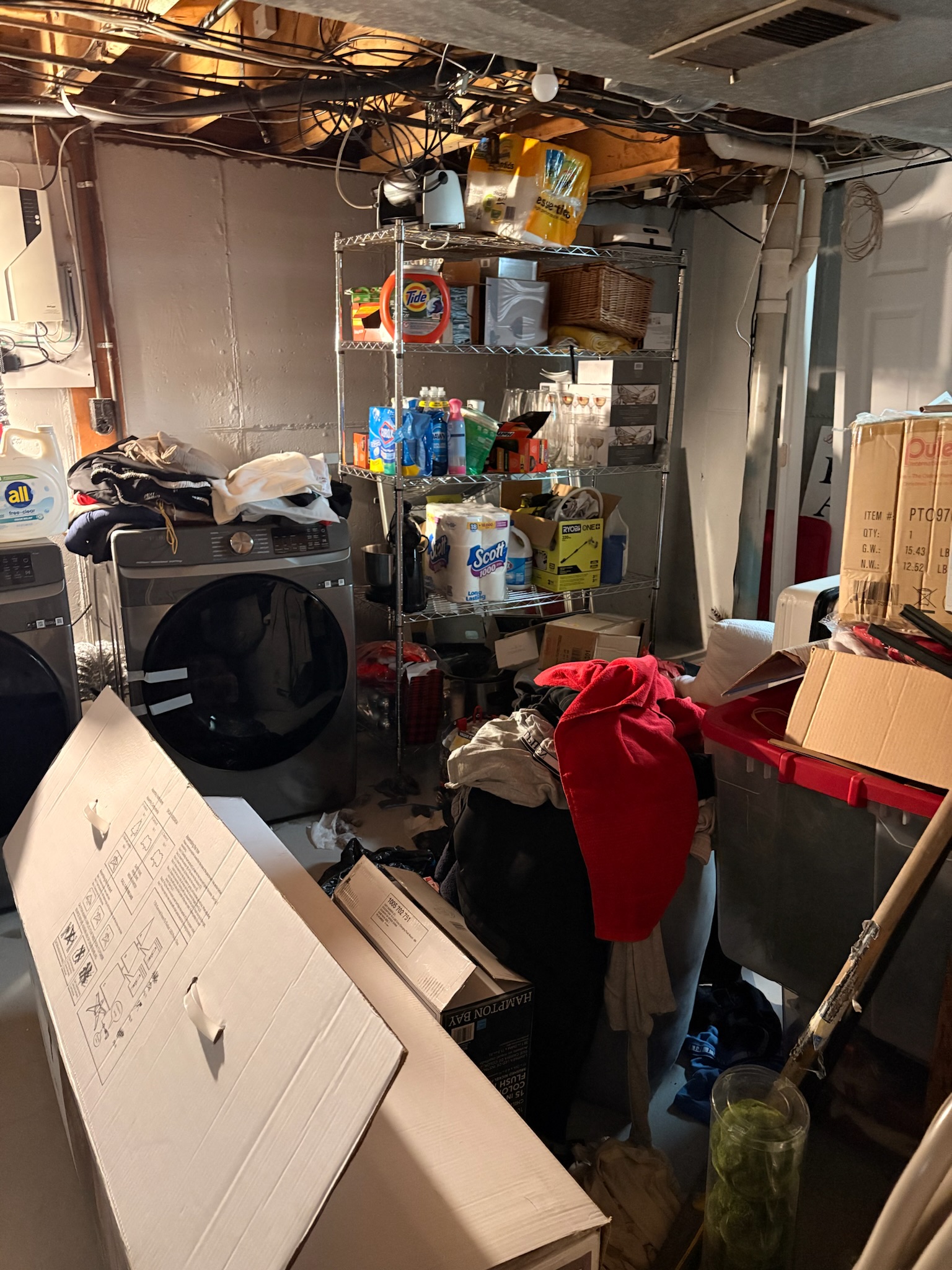 Cluttered basement before Get Rewardrobed